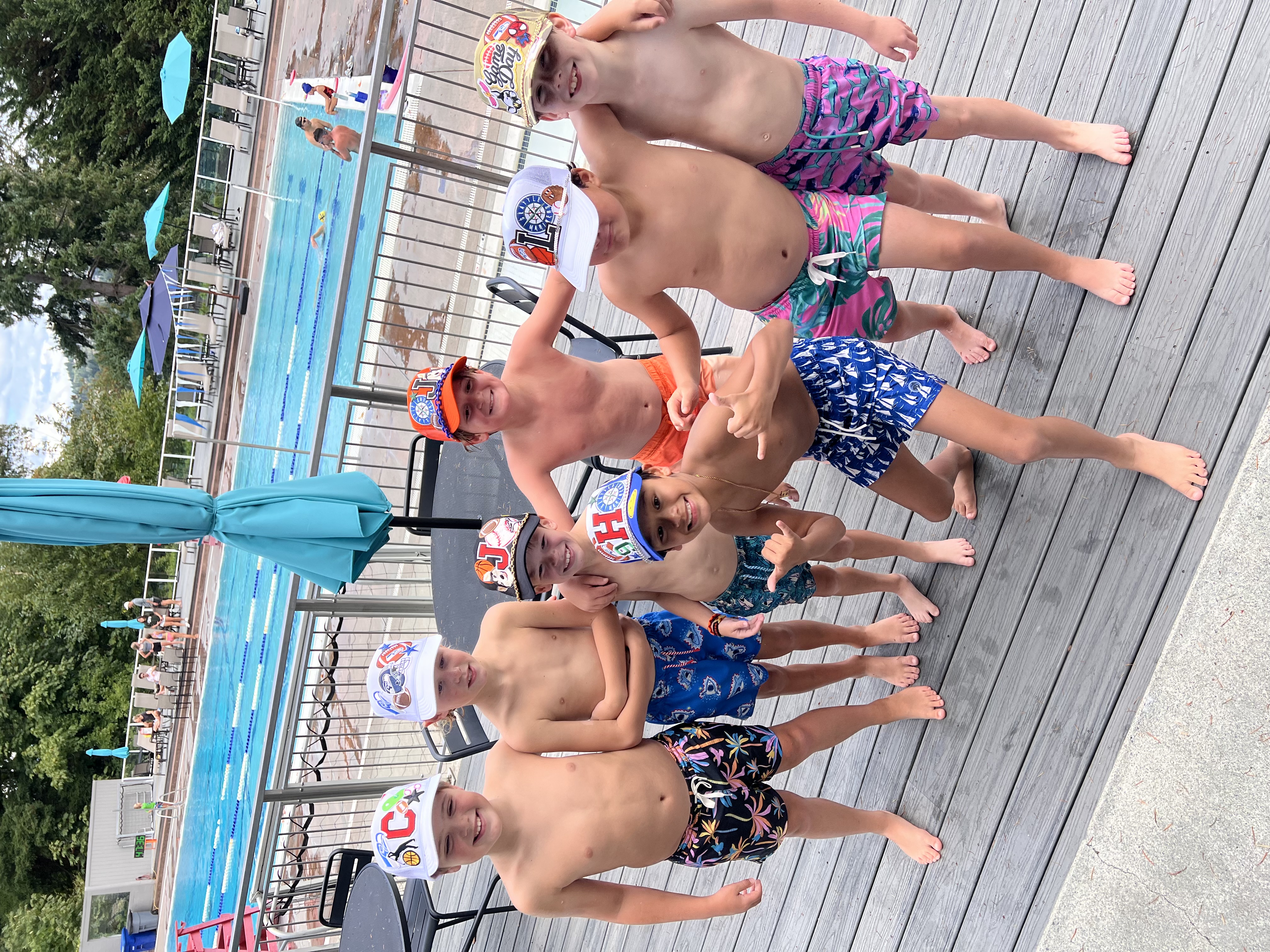 Kids in custom hats at the pool